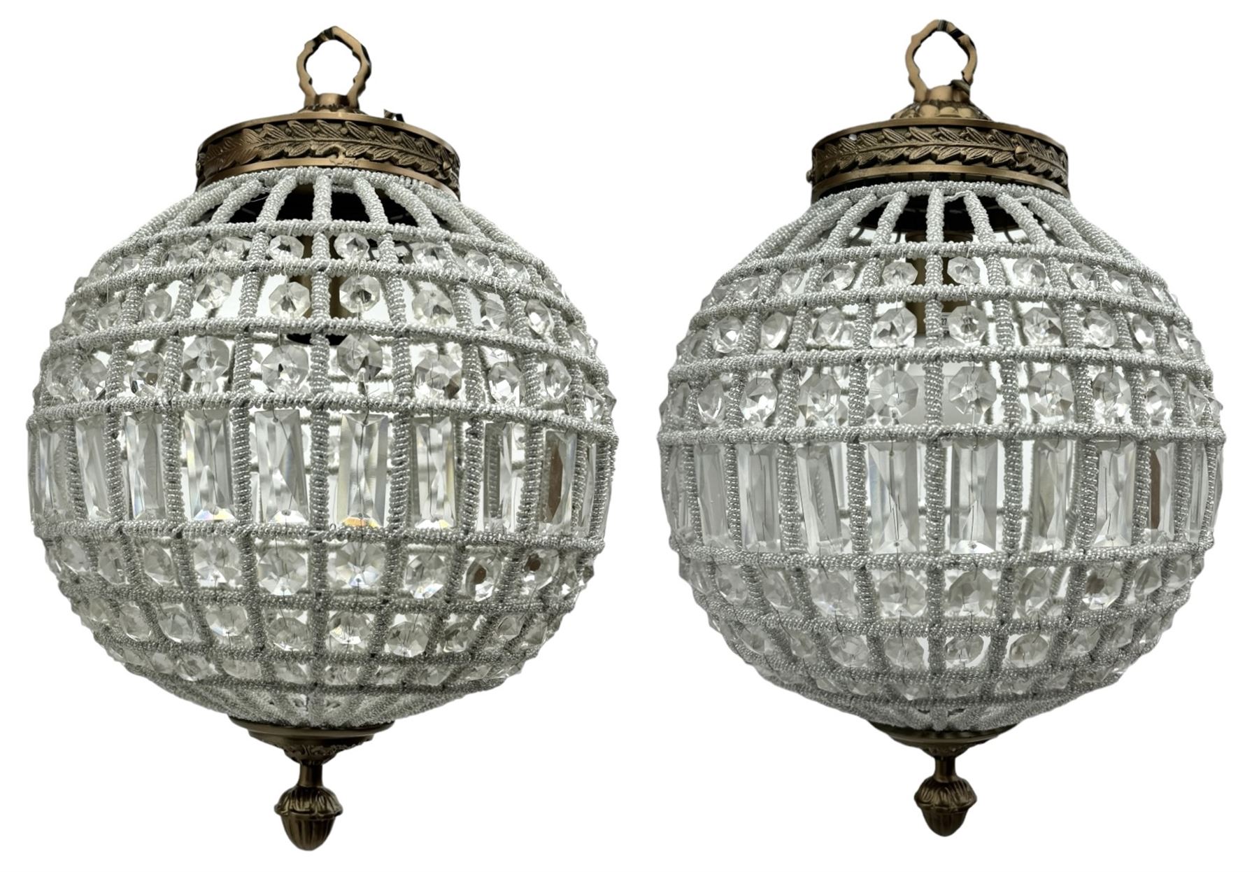 India Jane Interiors - pair of gilt metal and glass spherical ceiling light pendants, decorated with glass beads and pendants, foliage cast metal upper band, mounted by lower finial - ex-display/bankruptcy stock 