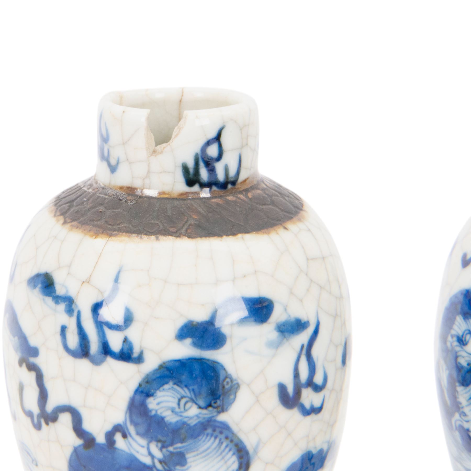 Pair of 20th century Chinese crackle glaze vases, of baluster form, decorated with dogs of foo amongst clouds, H23cm