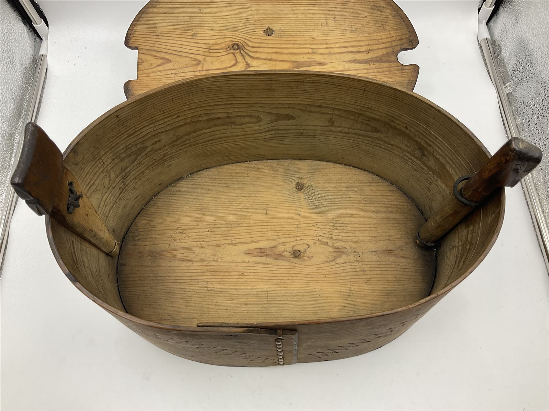 19th century Scandinavian Svepask / Tine box, the pine oval form body with notched posts and conforming lid decorated with Folk Art style pokerwork decoration and single carry handle, L38cm
