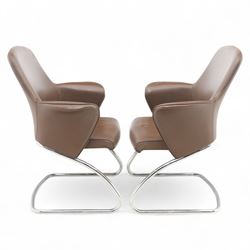 Two Senator executive cantilever chairs, upholstered in Padova hide, moulded back and integrated armrests, raised on a tubular chromed cantilever base