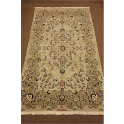  Persian Kashan carpet, pale pistachio green ground with blue  interlacing scrolled design, floral motifs, signed in red, 410cm x 230cm  