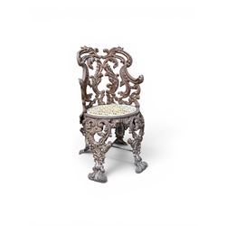 19th century Rococo Revival cast iron garden chair, pierced back comprised of scrolling acanthus leaves, over a pierced geometric white painted drop-in seat, raised on four acanthus and anthemion shaped cabriole supports united by X-frame stretcher