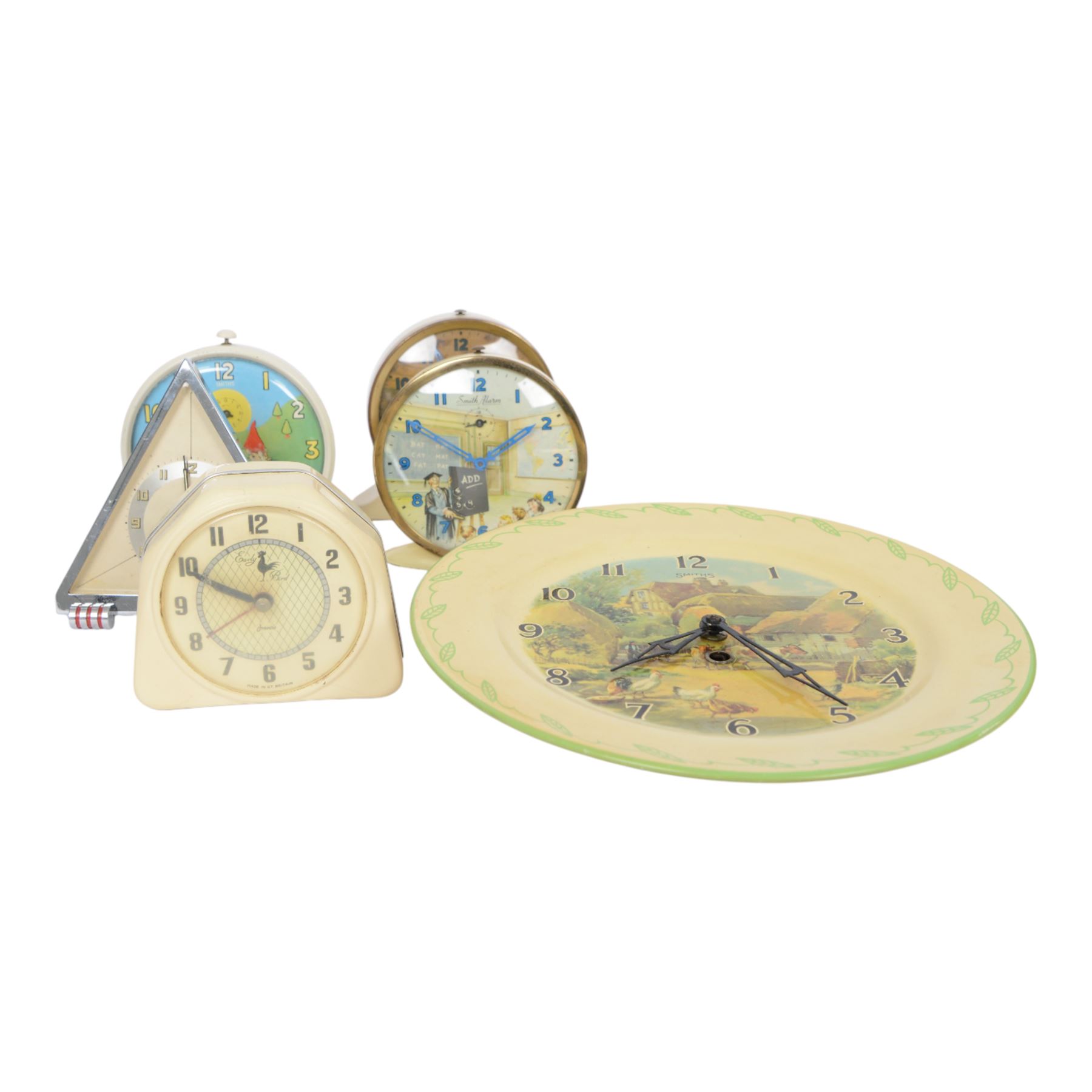 Three Smiths children's alarm clocks, including Noddy, two school adding clocks, Smiths ceramic plate wall clock, Francis Early Bird clock and an Art Deco triangular clock