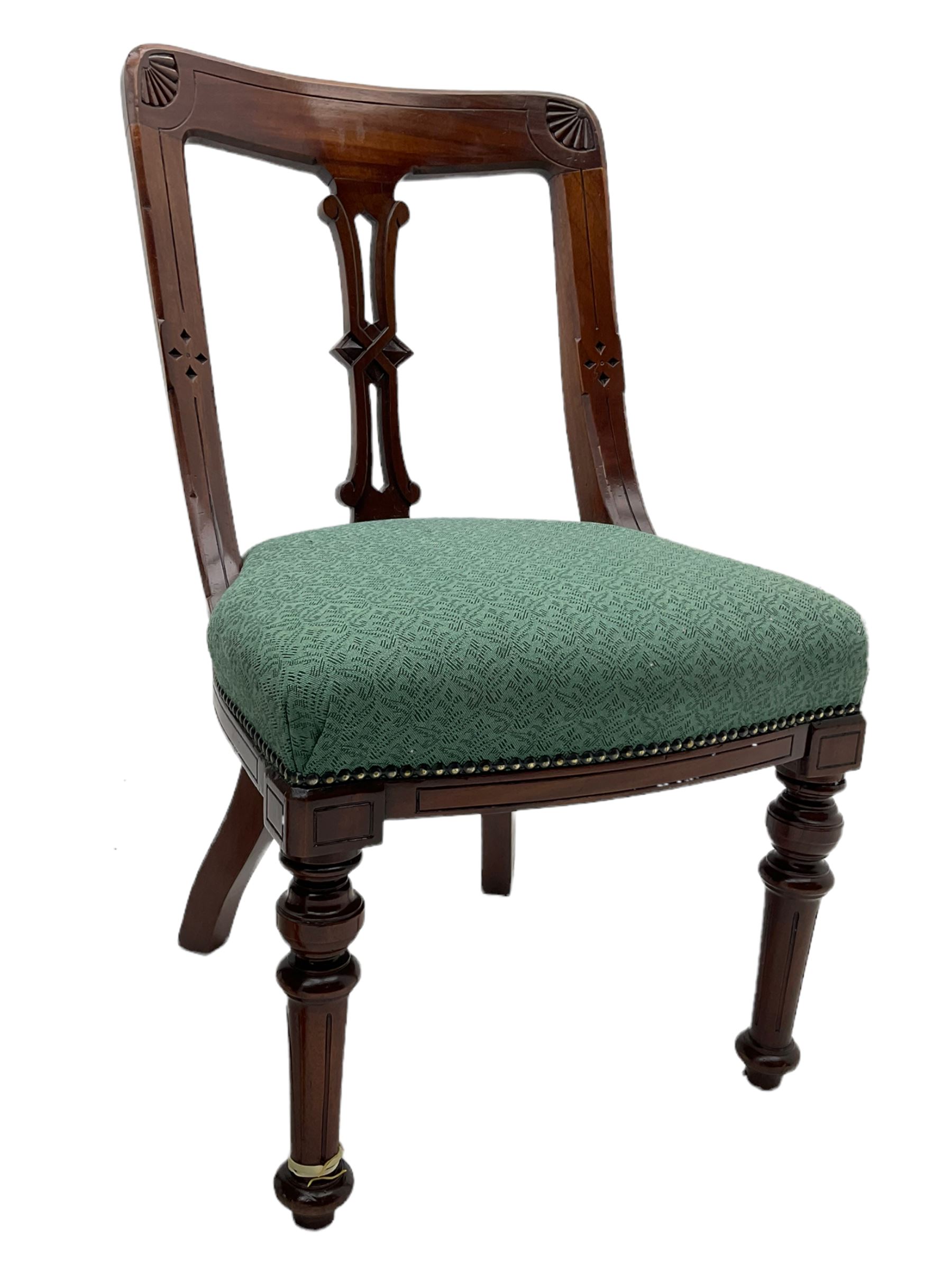 Set of four Victorian mahogany spoon back dining chairs, upholstered seats