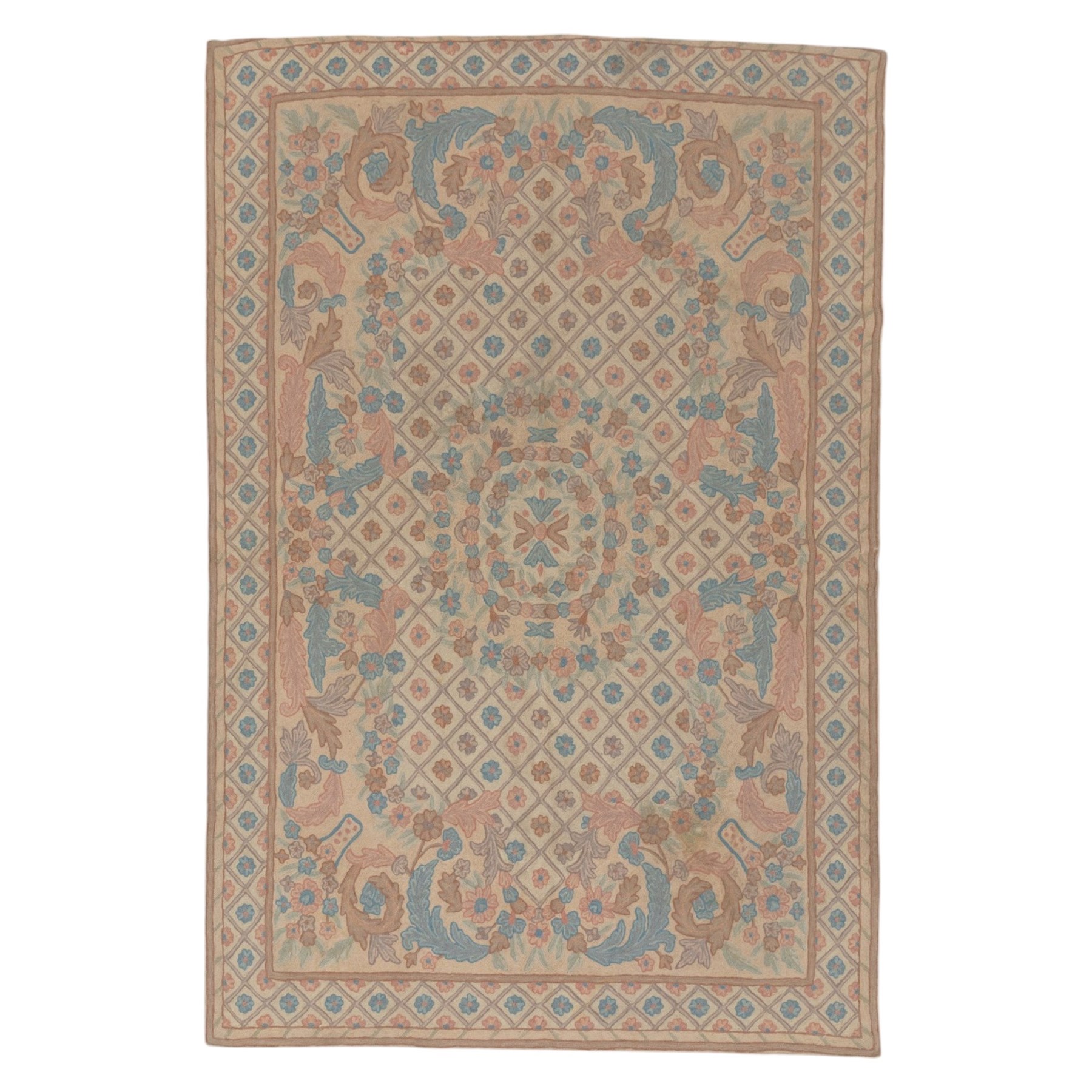 Aubusson design pale peach ground rug, woven with an all-over lattice design in rose and cyan with central floral bouquet medallion, the scrolling acanthi and flowerhead spandrels contained within a lattice guard band