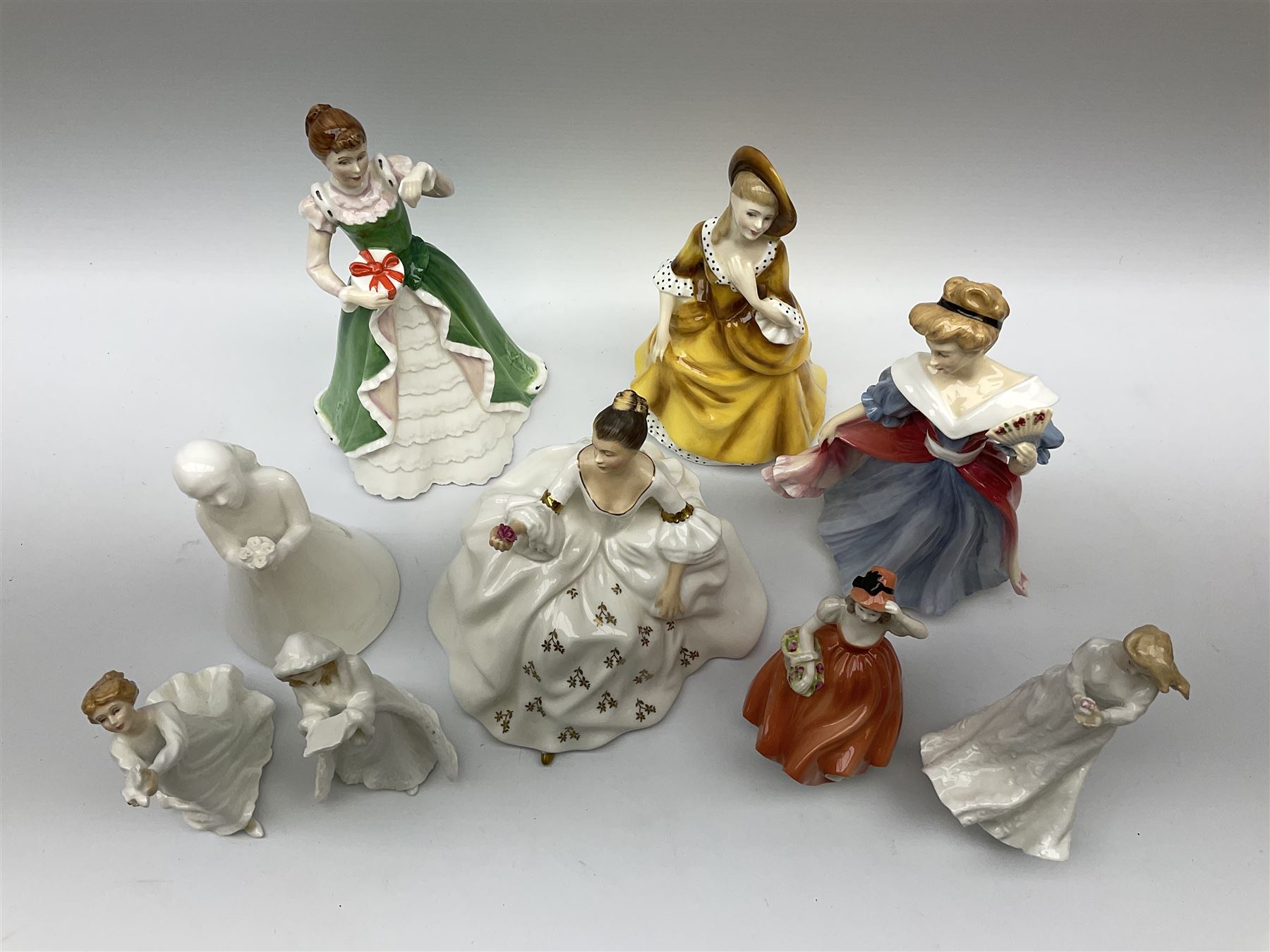 Nine figures; eight Royal Doulton, , Amy, Sandra, thank you, thinking of you, Christmas carols, my love, happy birthday, Merry Christmas and one Coalport figures, Andrea 
