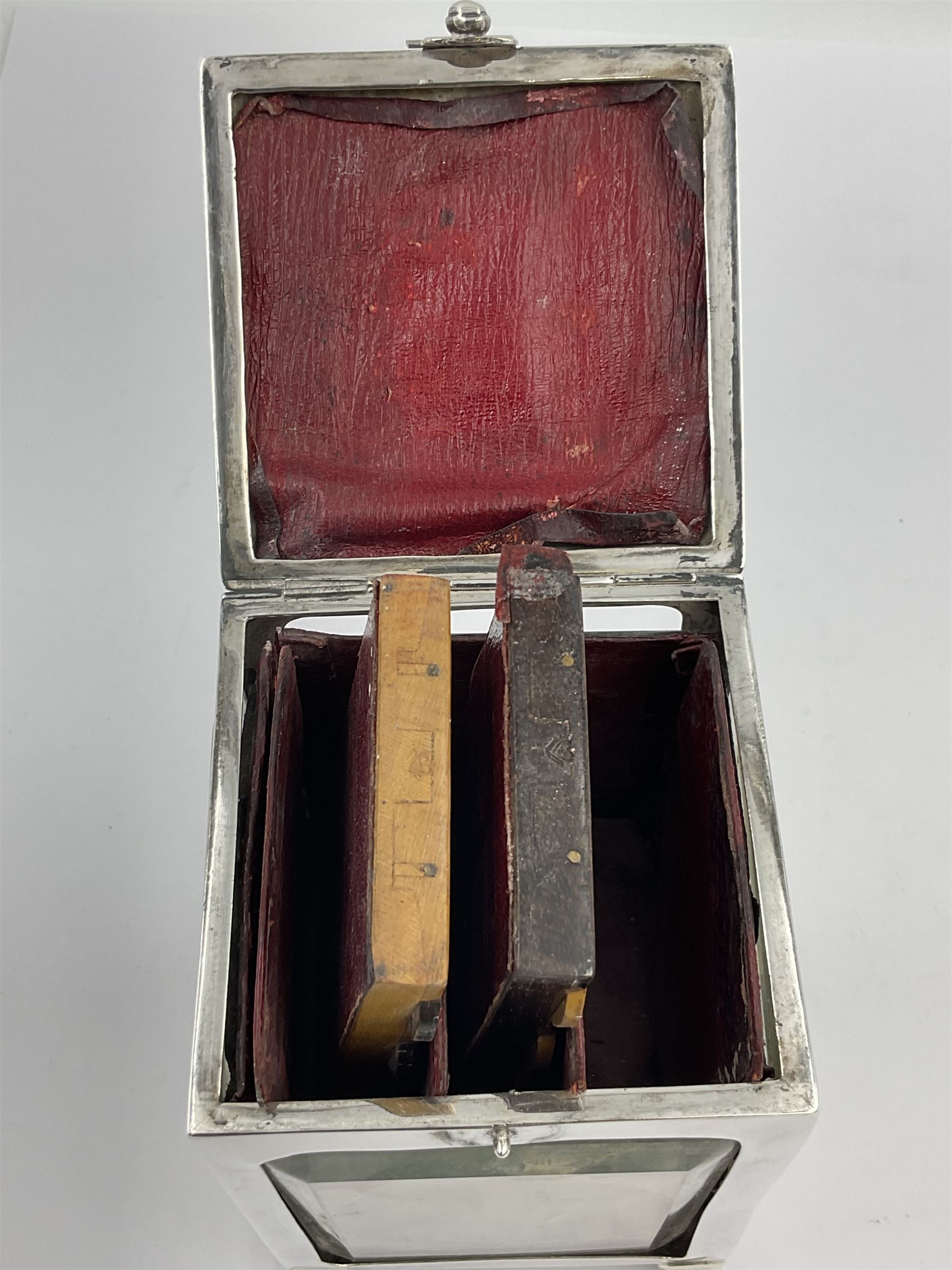 Edwardian silver mounted playing card case, hallmarked William Harrison Walter, Birmingham 1903, the sides each with a period playing card set behind a bevelled glass panel, the hinged cover with later engraving 'Presented to Norman T Crombie Esq by the officers & men of the 31st WR Detachment for services rendered 1917-1918', with red leather lined interior, the three compartments upon a sprung base and containing two later wooden Whist markers, case H12.5cm