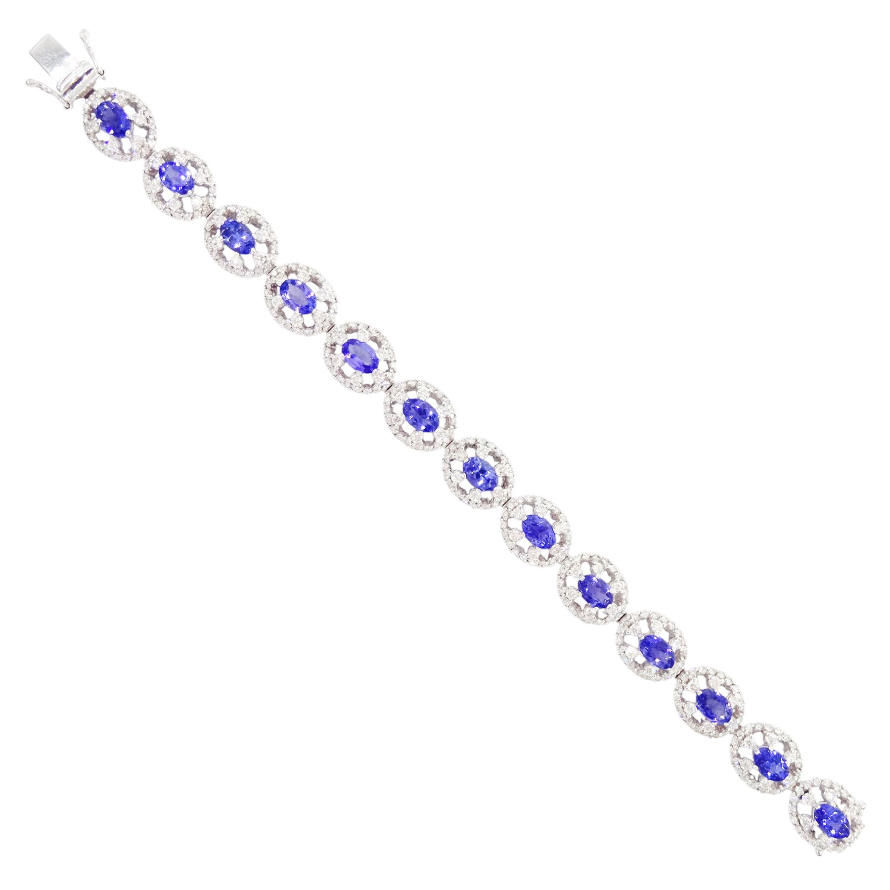18ct white gold tanzanite and diamond bracelet, twelve oval link clusters set with oval cut tanzanite's and round brilliant cut diamonds, stamped 750, total tanzanite weight approx 7.15 carat, total diamond weight approx 4.00 carat