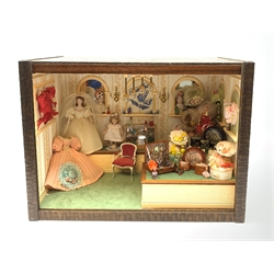 A 1/12th scale diorama of a ladies boutique, depicting a wall papered and mirrored interior with Hepplewhite style chair,  mannequins, various wall displays, perfume cabinets, hat stands, and bag displays, etc., H29cm L40cm D26cm.