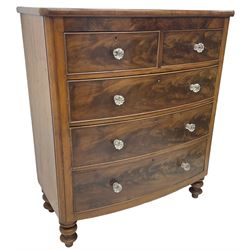 Victorian mahogany bow front chest, fitted with two short over three long graduating cock-beaded drawers, each with glass handles, raised on turned feet