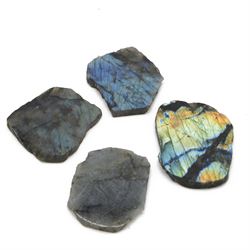 Four polished labradorite coasters with raw edges, approximate D8cm