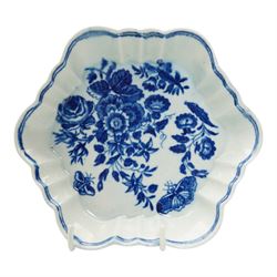 First Period Worcester porcelain teapot decorated in the Three Flowers pattern, with flower knop handle, H15cm and Worcester fluted dish decorated in the same pattern, both with cresent marks beneath (2)