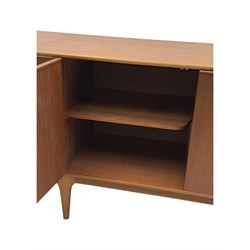 Tom Robertson for AH McIntosh & Co of Kirkaldy - mid-20th century teak 'Dunvegan' sideboard, with three graduating drawers fitted cutlery divider, three cupboards one fall front each with recessed sculptural handles, raised on shaped and tapering supports