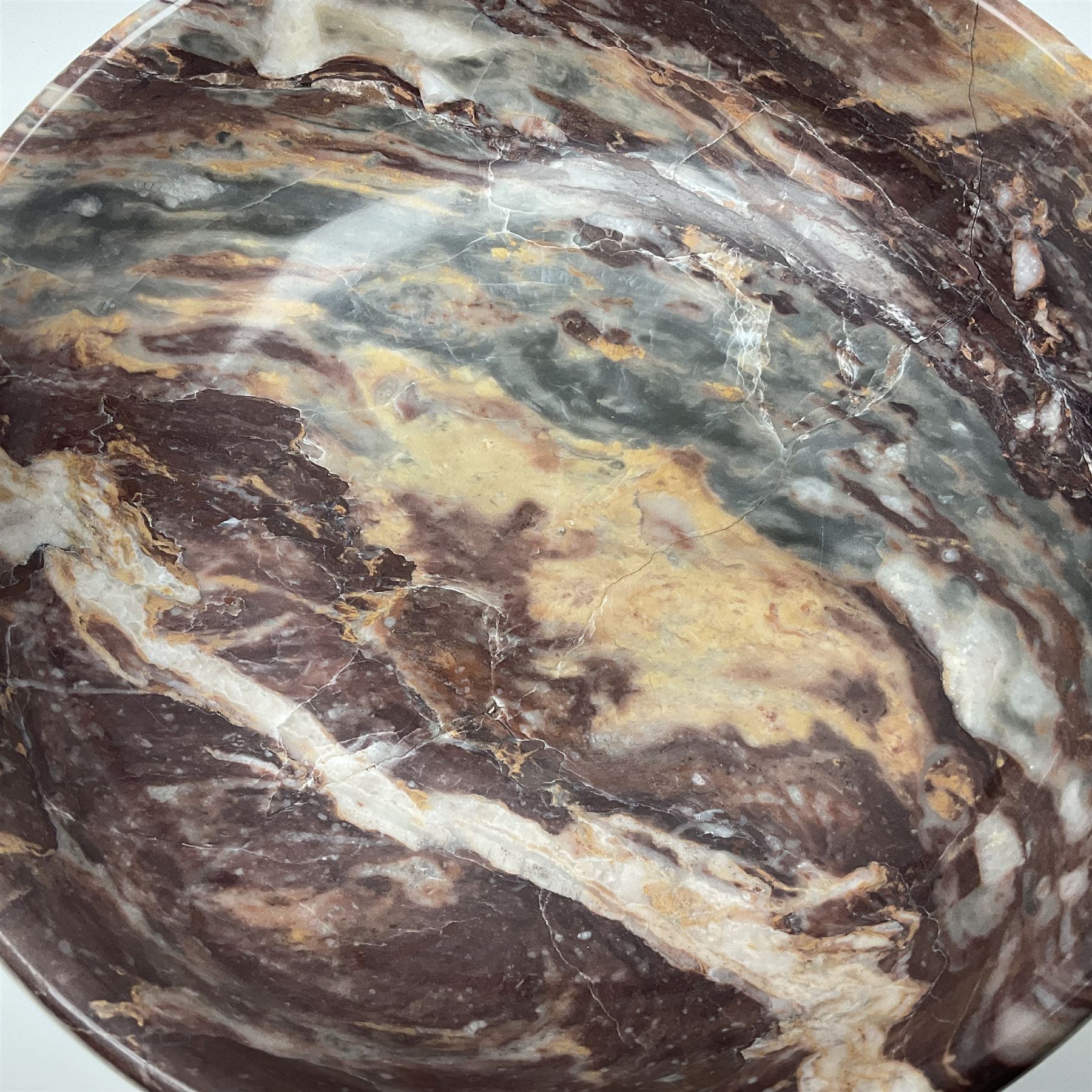 Pink veined marble bowl, of circular form, upon a spreading circular foot, D22cm H12cm
