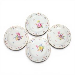 Four early 20th Century Meissen plates, hand painted with floral sprays, sprigs and inspec...