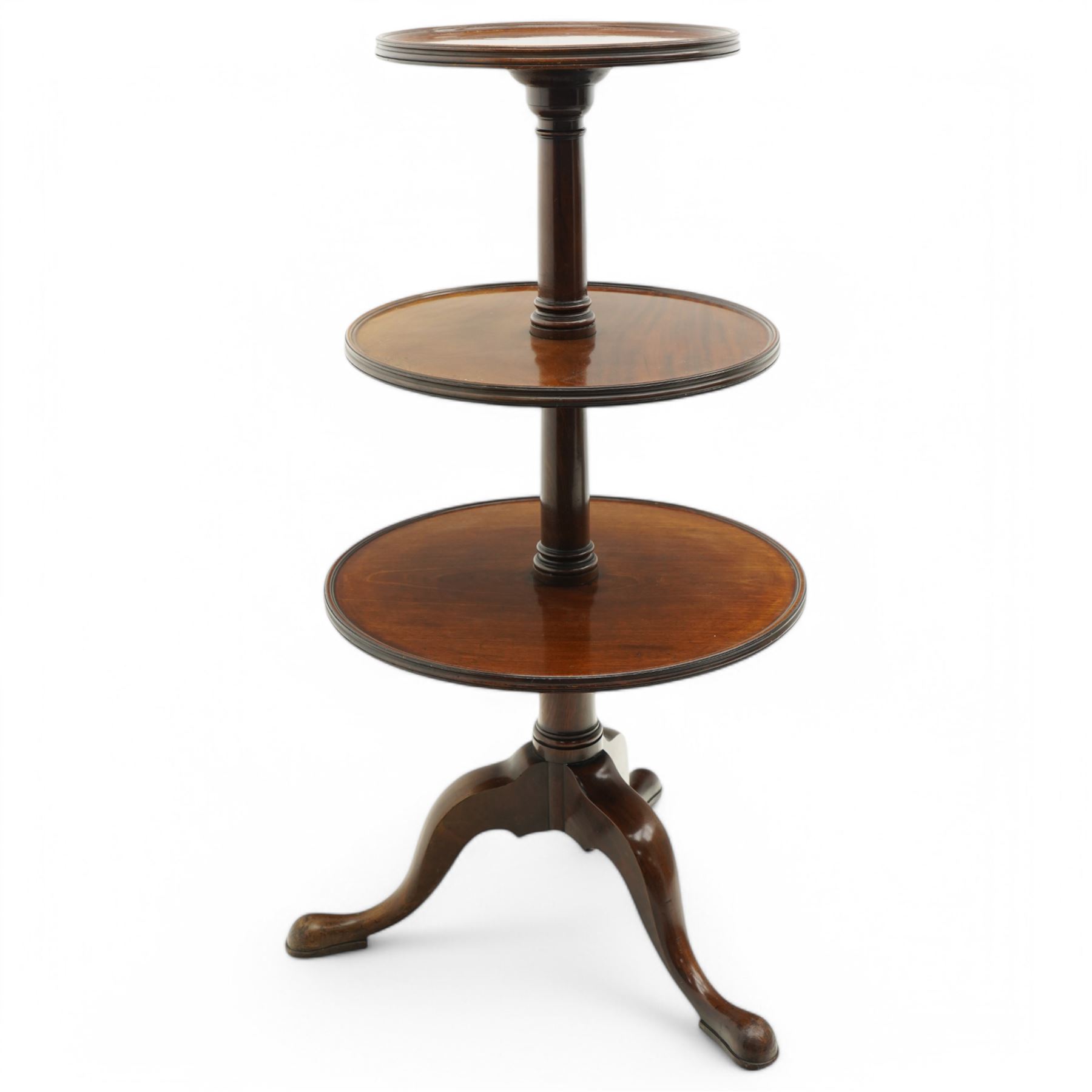 George III mahogany tripod dumb-waiter, three graduating tiers with moulded and lipped edges, on ring turned barrel pedestal supports, on three out-splayed supports 