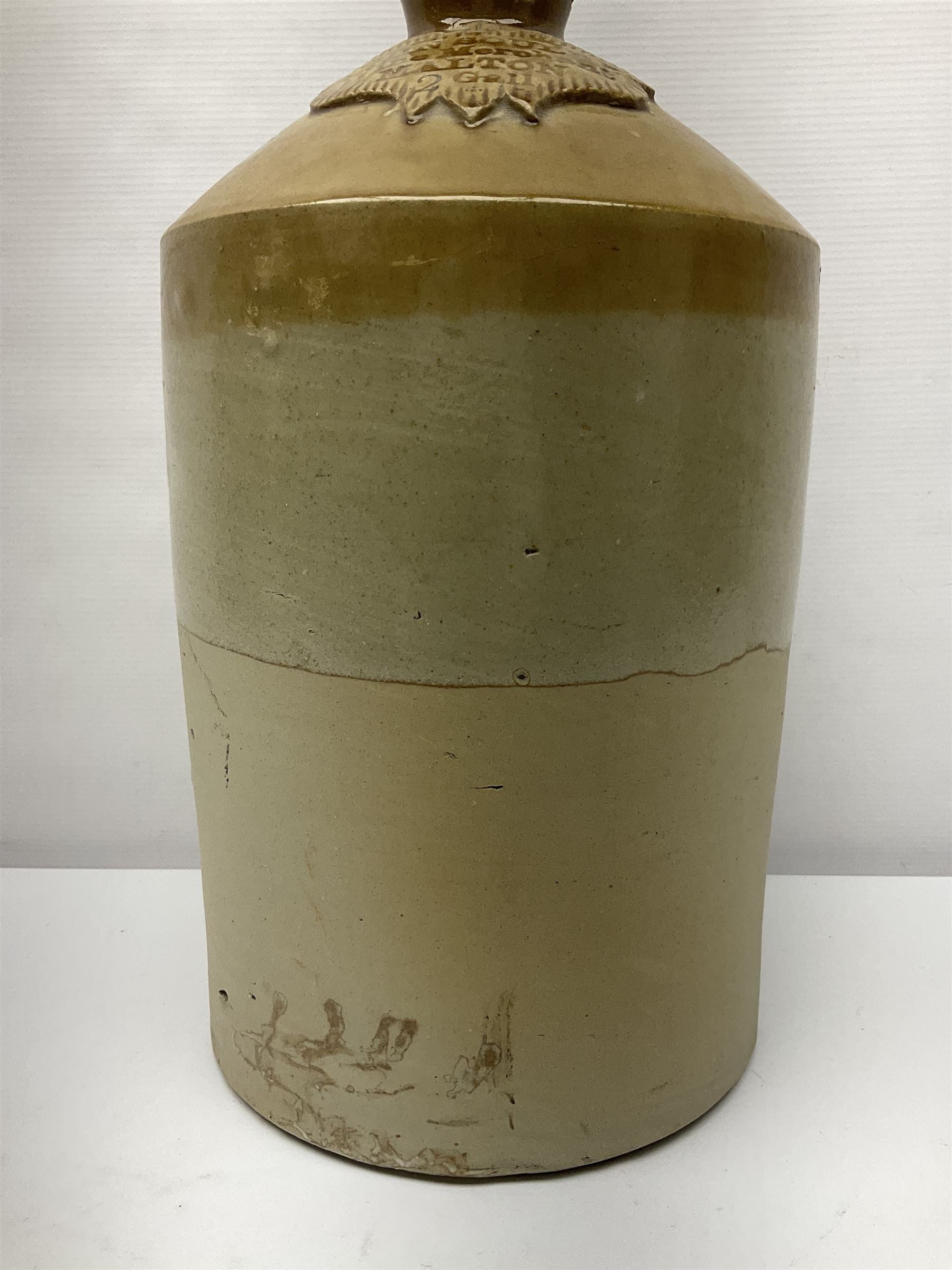 Large 2 gallon stoneware flagon, stamped 'John Soulby Wine Merchant Malton 2 Gall', together with a collection of similar stoneware jars and bottles, largest H40.5cm