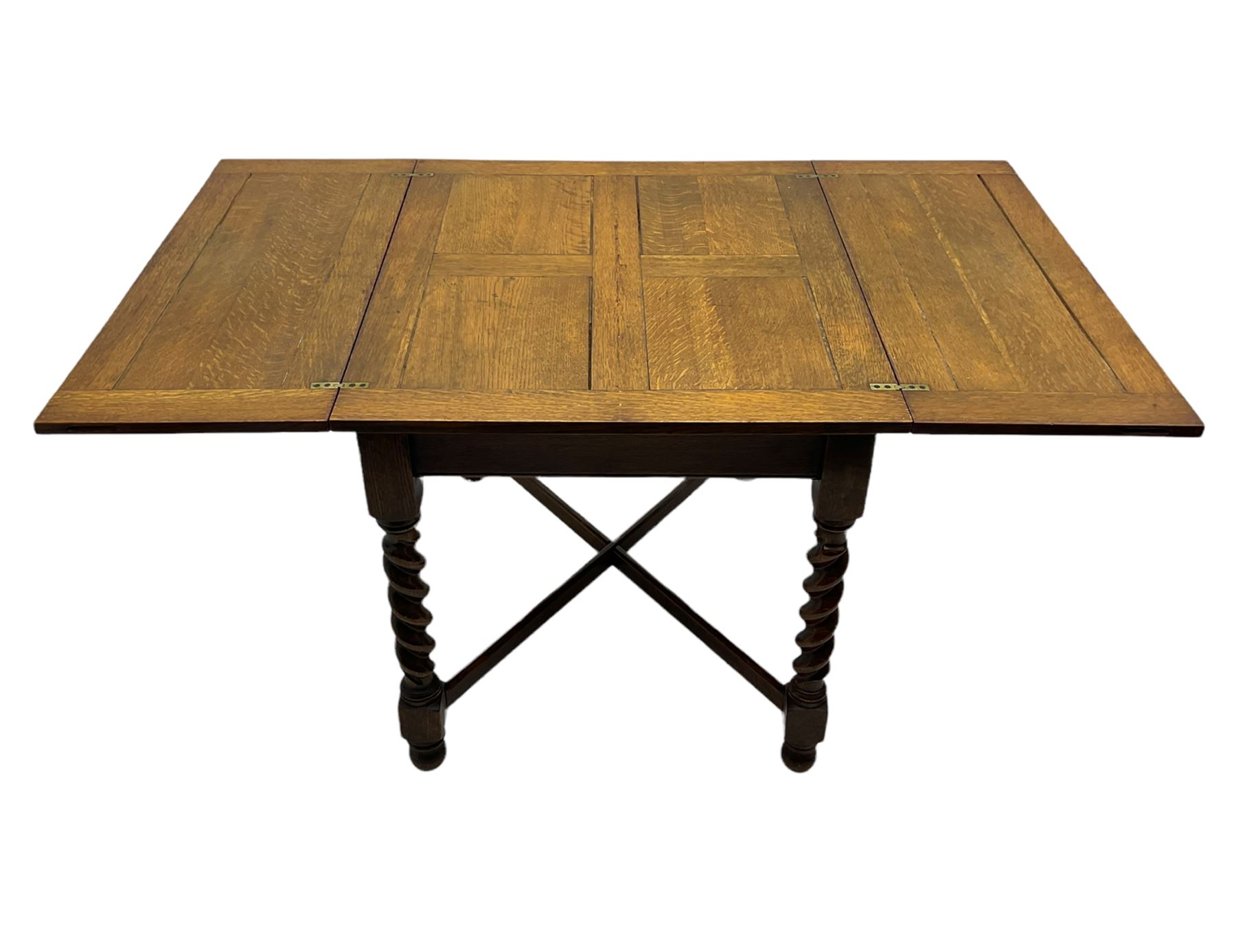 Early 20th century oak barley twist extending table, two fold-over leaves with pull-out stays, spiral turned supports joined by x-stretchers