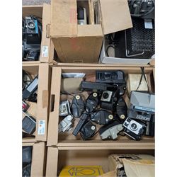 Collection of vintage cameras, projectors and accessories, including Kodak Brownies, Praktica, Polaroid, Ensign, light meters, flashes, etc