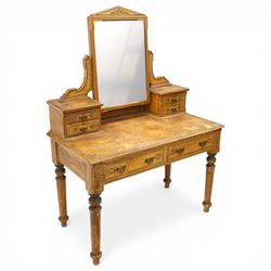 Late Victorian Aesthetic Movement scumbled and painted pine dressing table, arched swing mirror over four small trinket drawers, decorated with painted ebonised stringing and Aesthetic Movement motifs, rectangular top fitted with two drawers, on turned supports