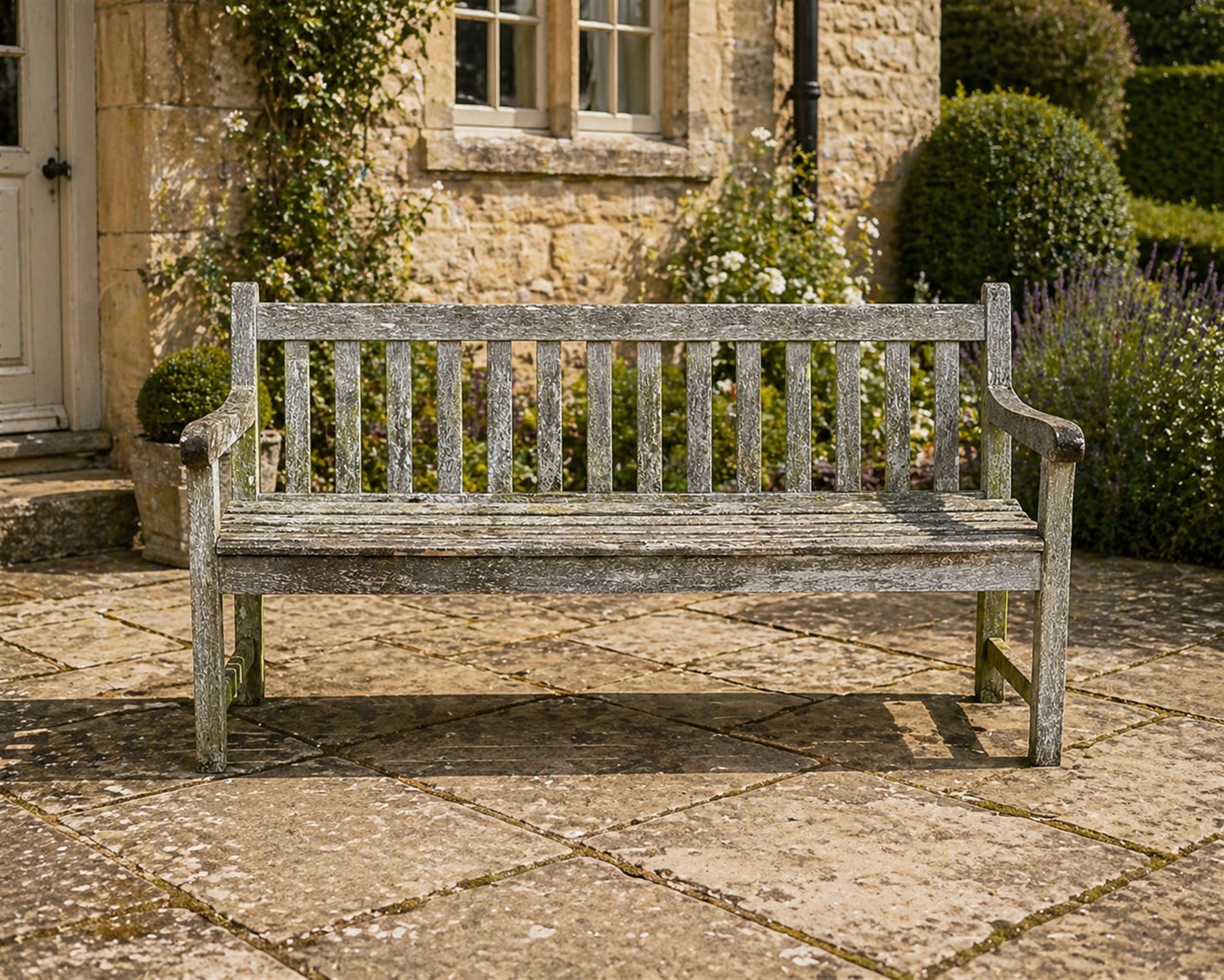 Weathered teak garden bench, slatted seat and back, square form arms and legs