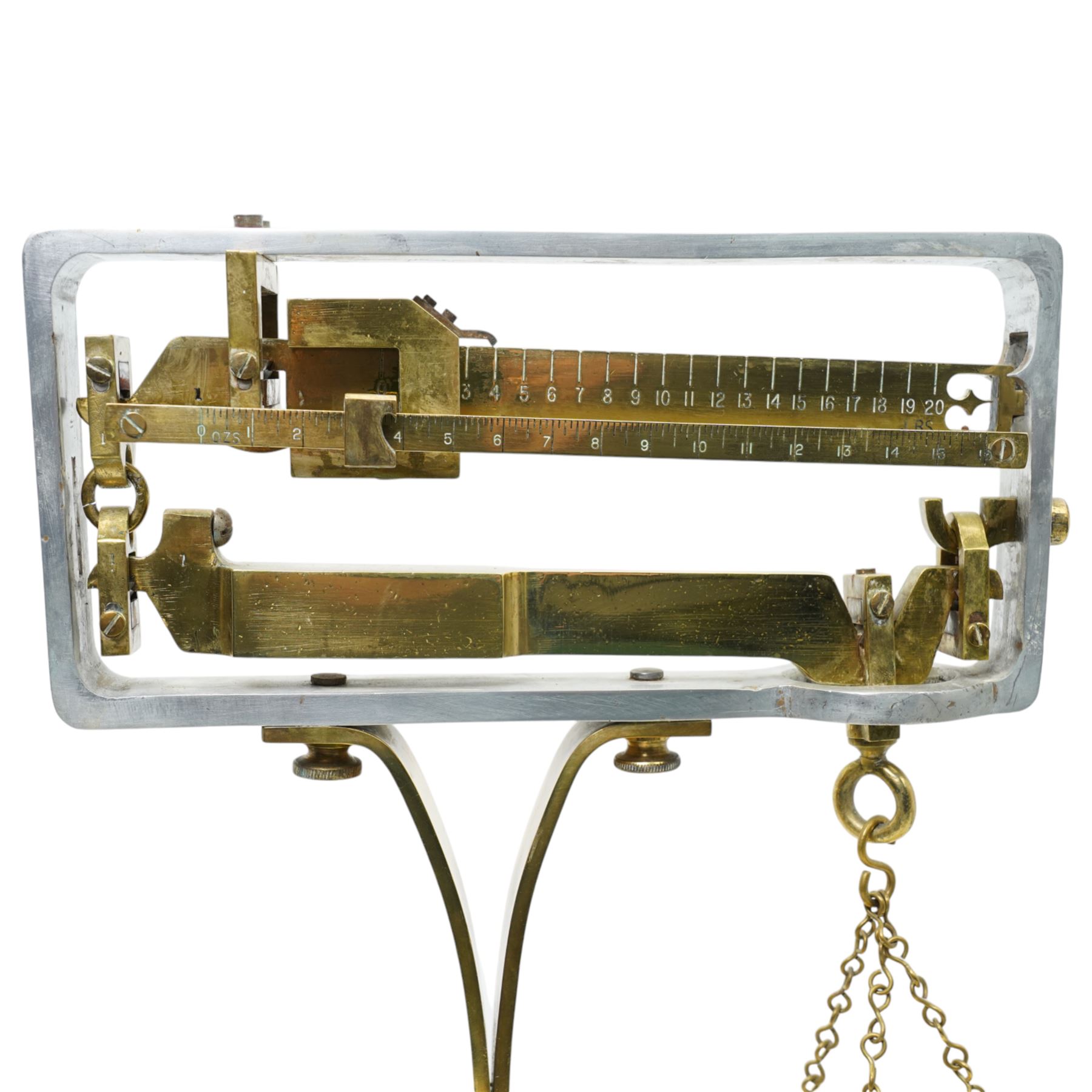 Set of brass balance scales on platform base 