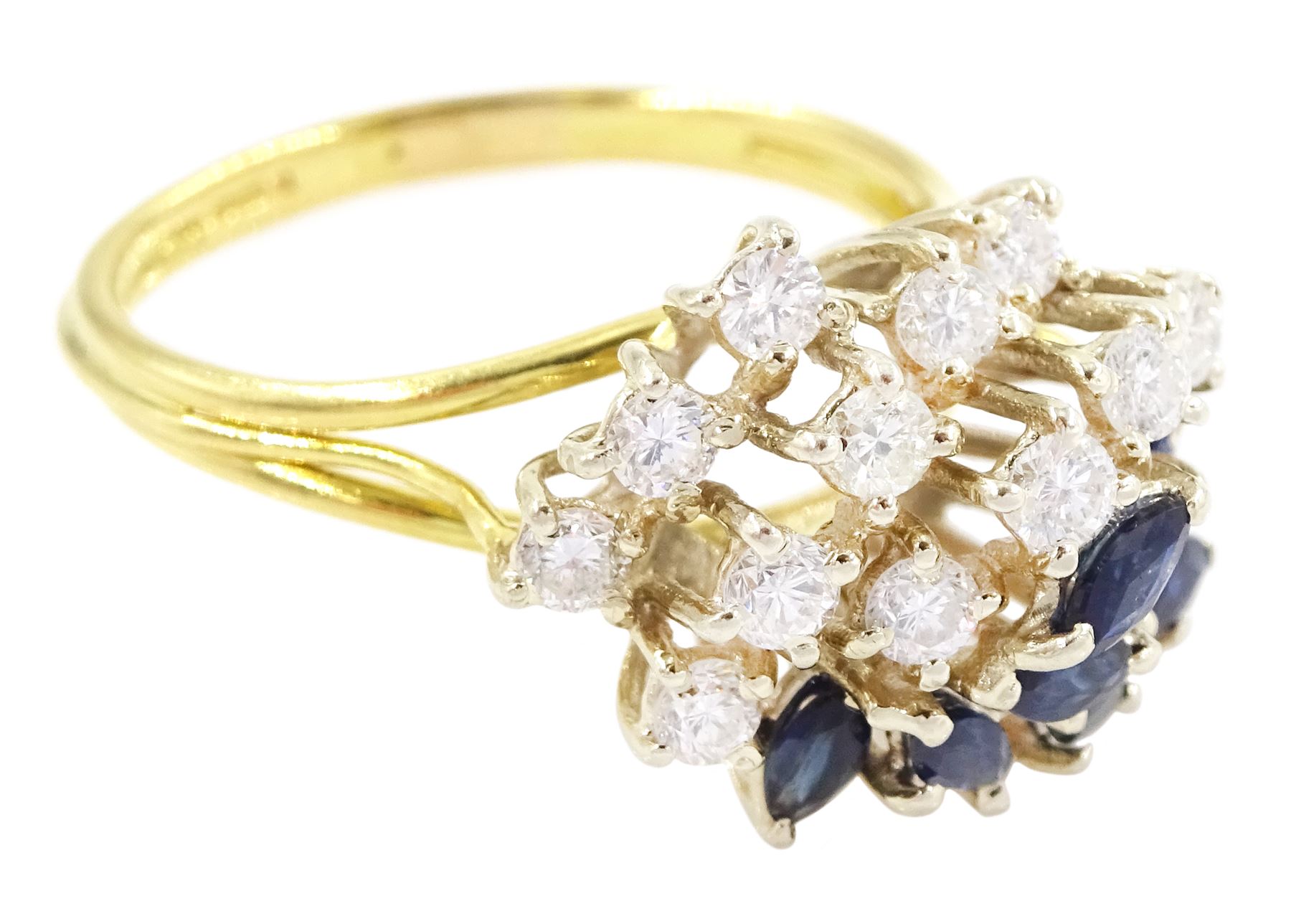 18ct gold sapphire and diamond cluster ring, twelve round brilliant cut diamonds and eight marquise cut sapphires, in a swirl design setting, Sheffield import mark 1989, total diamond weight approx 0.70 carat
