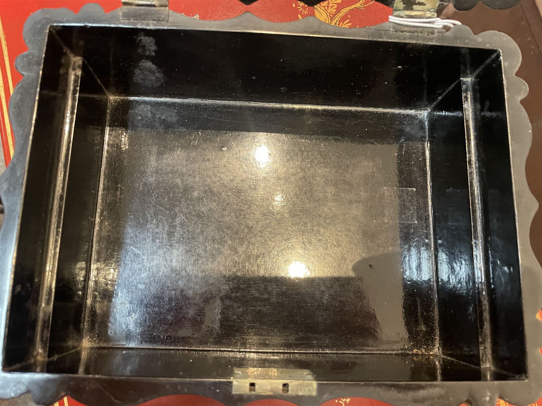 Victorian black lacquered papier-mâché sewing box, of rectangular form with shaped sides, the slightly domed top with inlaid mother of pearl and abalone decoration, the sides with gilt and polychrome painted scrollwork, the hinged cover opening to reveal a fitted interior with lift out tray, H14cm