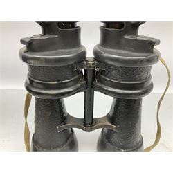 Pair of WWII German U-boat binoculars probably 7 x 50 by Leitz, with rubber eye piece protector covers and leather case stamped with Kriegsmarine mark to the lid and dated 1944, with leather strap.