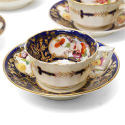Collection of early 19th century Coalport pattern tea ware decorated with panels of flowers within a blue and gilt surround comprising eight tea cups, three coffee cups, eight saucers, four large plates, two handled sucrier and cover, milk jug and slop bowl and a similar small dish with loop handle