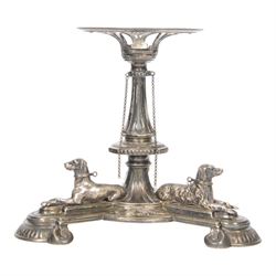 Edwardian silver plated centrepiece stand, the tripart base with applied recumbent hunting dogs interspersed with fox masks and game birds, the central knopped and tapering stem leading to a circular stand, marked 3251 beneath, H22cm  