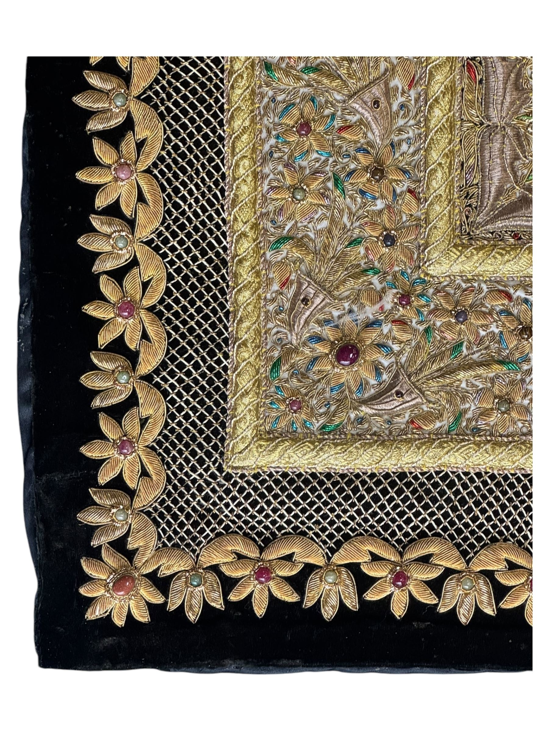 20th century large Zardozi wall hanging, hand embroidered in gold thread on black velvet ground with semi-precious stones and central medallion  149x93cm