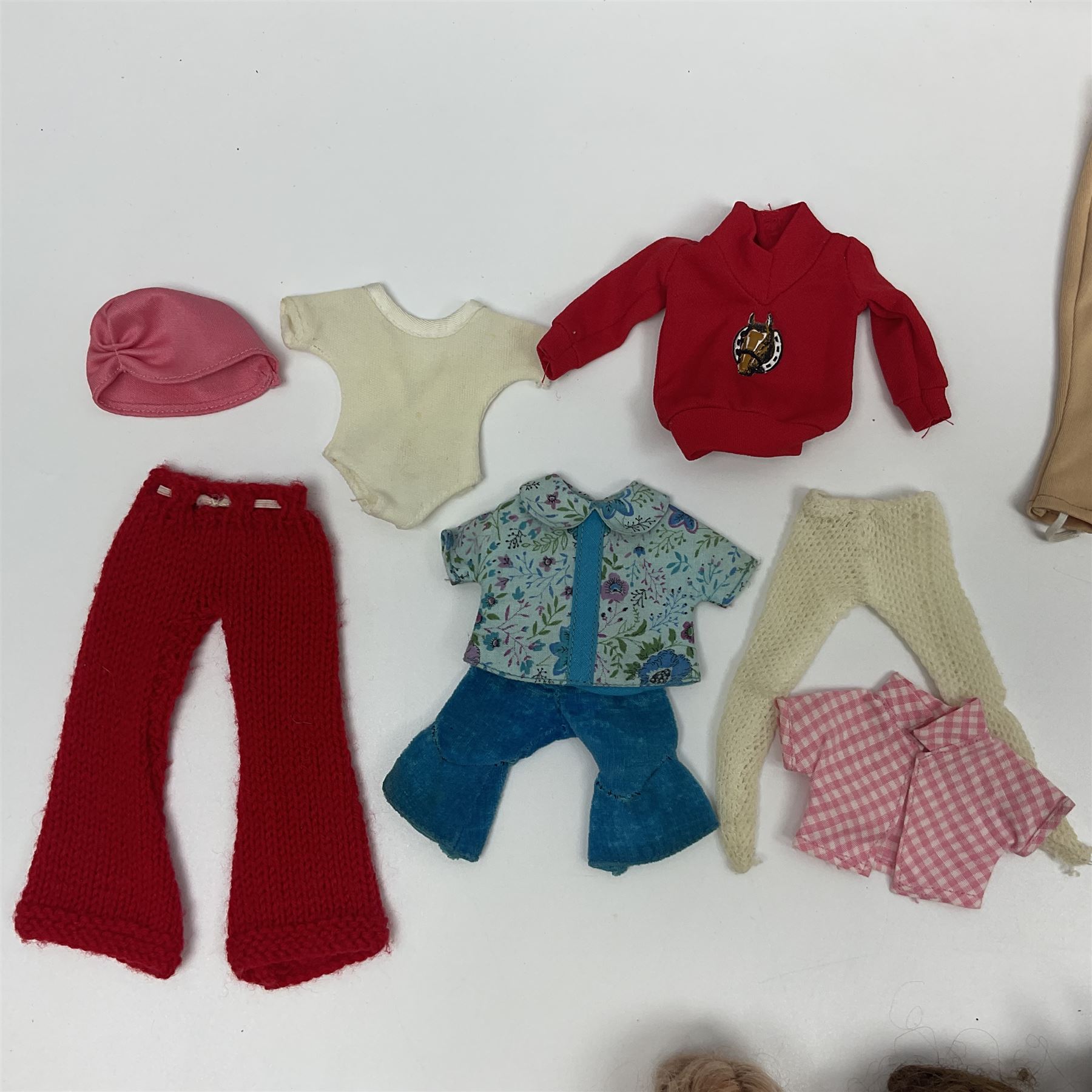 Six fashion dolls by Amanda Jane, Sindy and Barbie with various outfits, clothing and footwear