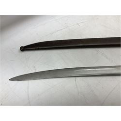 French model 1866 sabre bayonet, the 57.5cm curving blade marked St. Etienne 1868; in associated steel scabbard L71cm overall