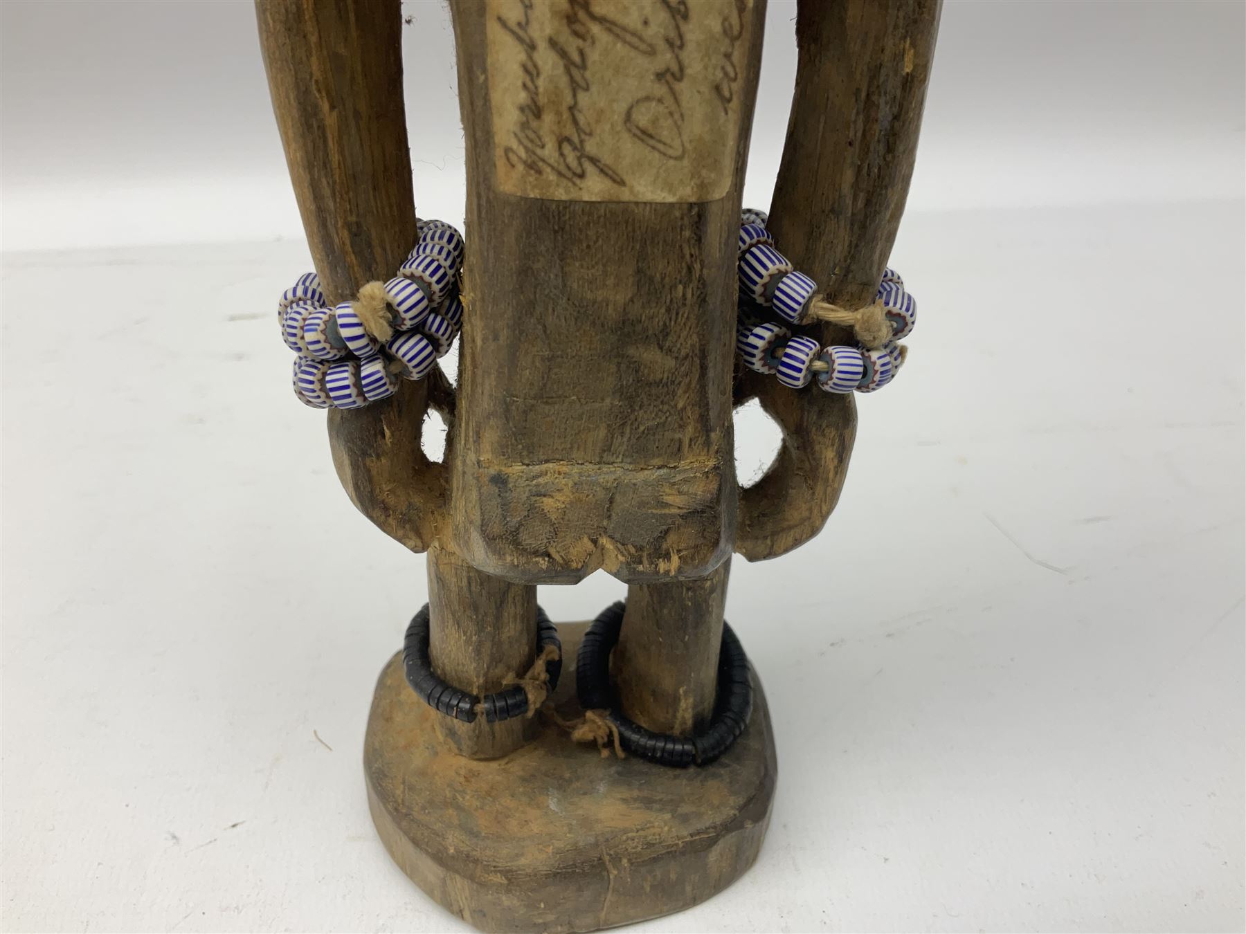 Early 20th century West African Yoruba family wooden figure of Orisha Oko, the god of farming/agriculture, carved from the solid, bears manuscript label of provenance verso H26.5cm