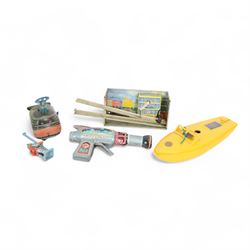Sutcliffe Models Comet clockwork speedboat, boxed with key, together with a Russian tinplate garage toy, Japanese tin plate Billy The Ball Blowing Magic Whale, tin plate space gun etc 