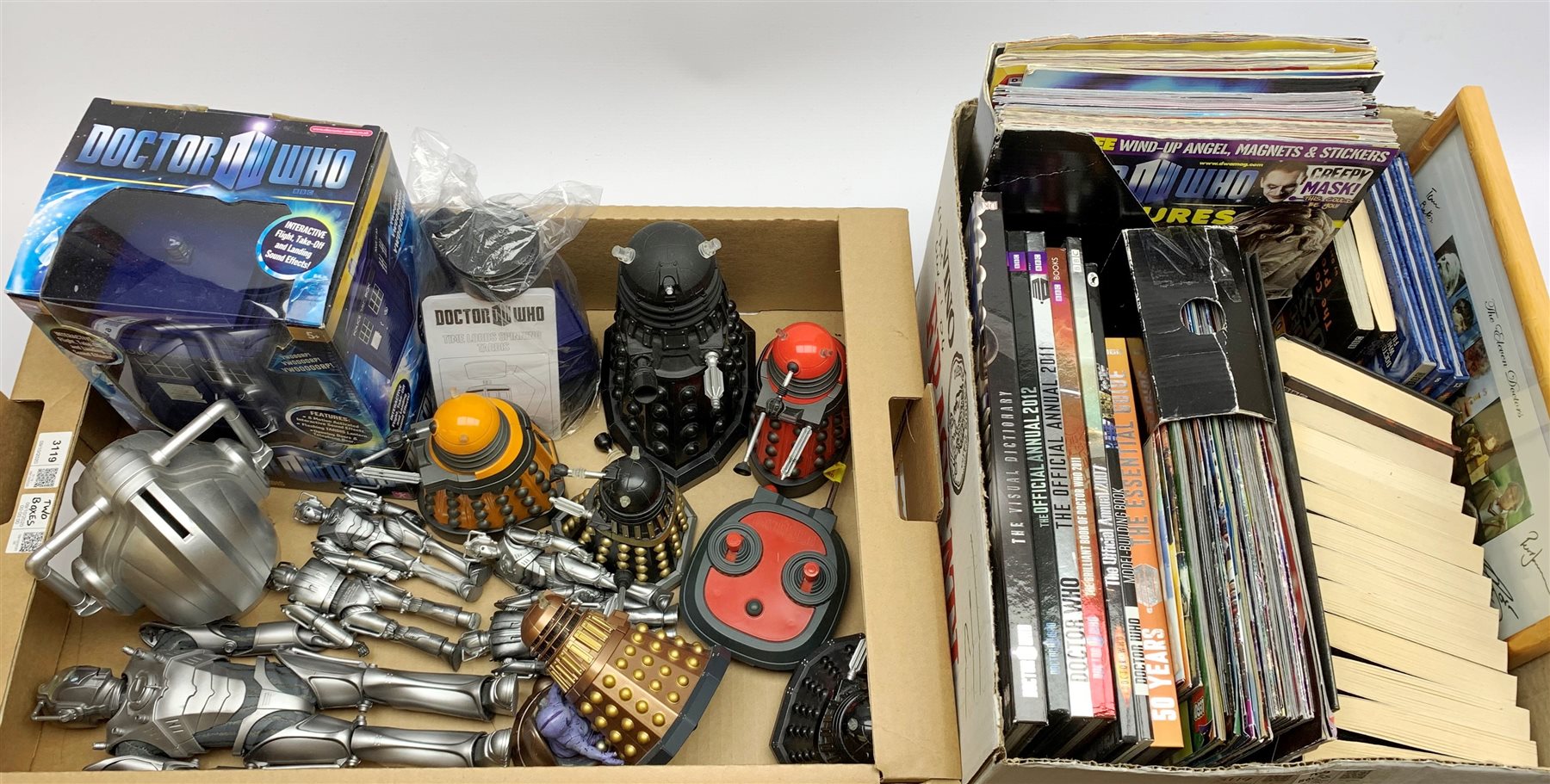 Dr. Who - Character Options Flight Control Tardis, boxed; Time Lords Spinning Tardis on stand; seven plastic Dalek figures, one with remote control; five Cyberman figures and money box; framed print of all Doctors with facsimile signatures; and quantity of Dr. Who annuals, magazines and books (in two boxes)