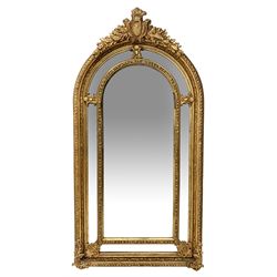 Gilt Rococo style mirror, arched top wit