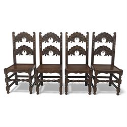 Early 20th century set of seven Jacobean Revival oak chairs, comprising pair of cavers and five chairs, each with carved mask and scroll decoration to the crest and and back rail, plain oak seat, upon turned front legs and block rear legs with conforming stretchers