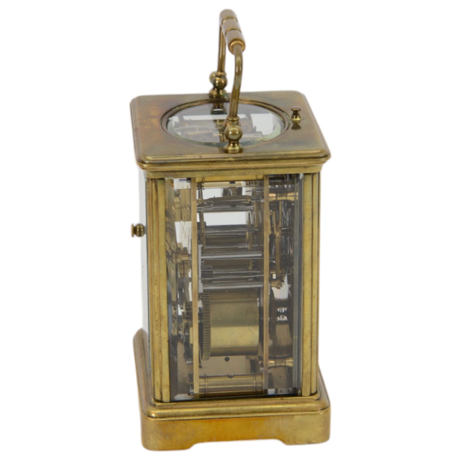 French - Early Edwardian corniche cased 8-day carriage clock, decorative enamel dial with floral garlands, Arabic numerals, minute markers, steel moon hands and conforming alarm setting dial, four rectangular glass panels and an oval viewing glass to the top, with a silvered lever platform escapement and 
timing screws to the jewelled balance, twin train rack striking movement with repeat, sounding the hours, half hours and alarm on a coiled gong.  Original traveling case with viewing glass and key.