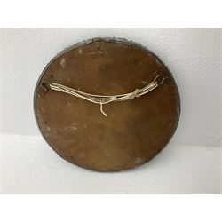 Arts & Crafts style circular hammered pewter mirror inset with four turquoise cabochons, D27.5cm