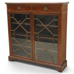 Late 19th century mahogany bookcase, fitted with two drawers over twin astragal glazed doo...