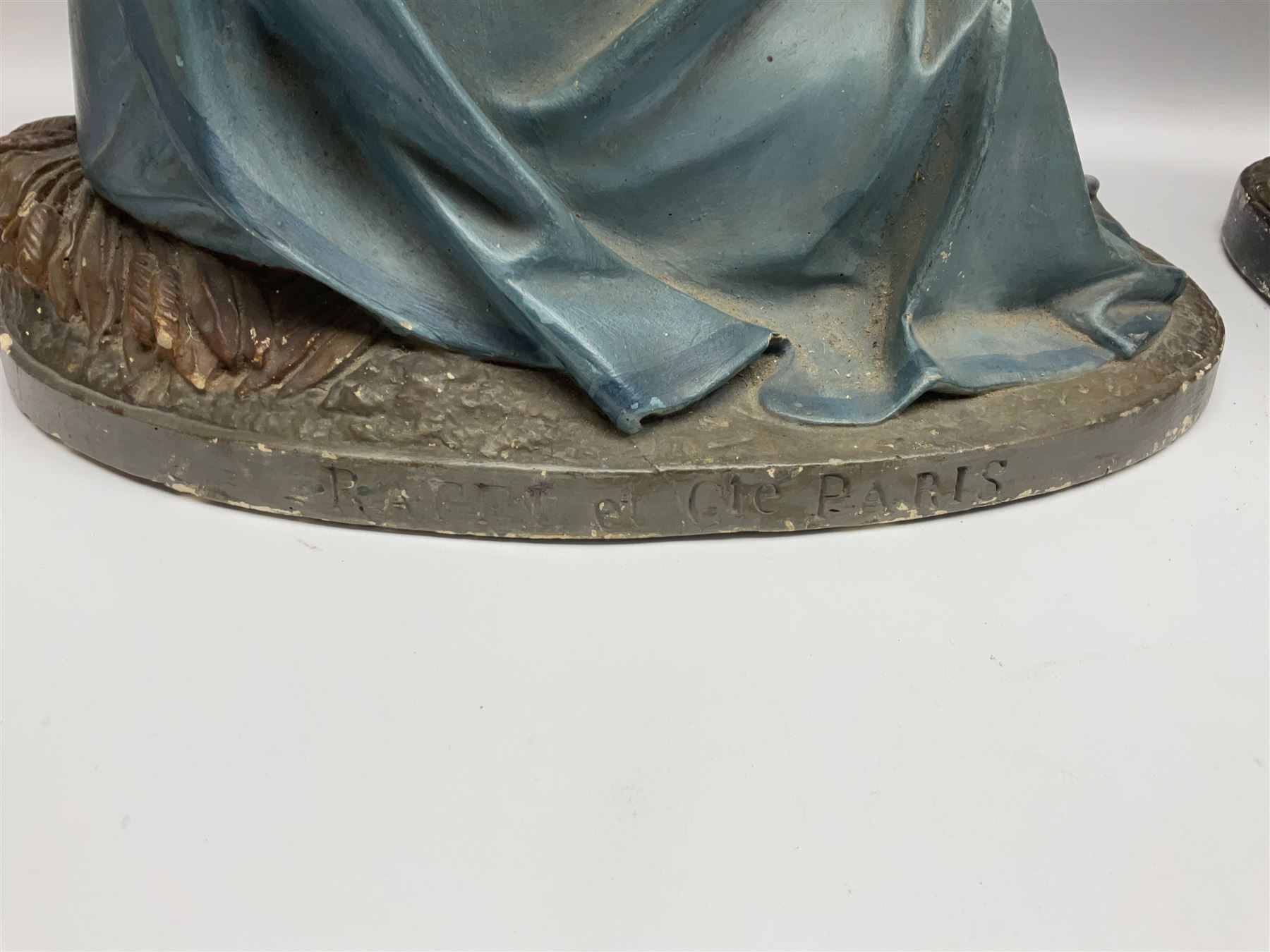 Two religious painted plaster figures of Mary and Joseph kneeling on oval plinths, with impressed mark 'Raffl et Cie Paris', H60cm 