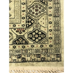 Persian design lime ground rug, repeating border, 140cm x 98cm