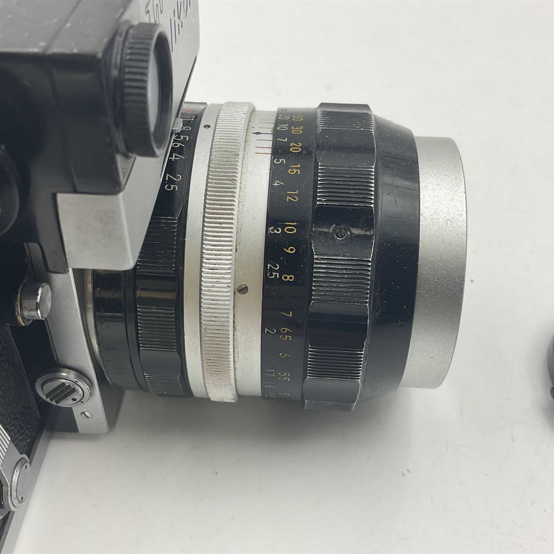 Nikon F Photomic NKJ camera body, marked 'US Dept of Defense ... U.S.A.F DA Nang, serial no. 6561811, with 'Nippon Kogaku NIKKOR-P Auto 1:2.5 f=105mm' lens, serial no. 212154