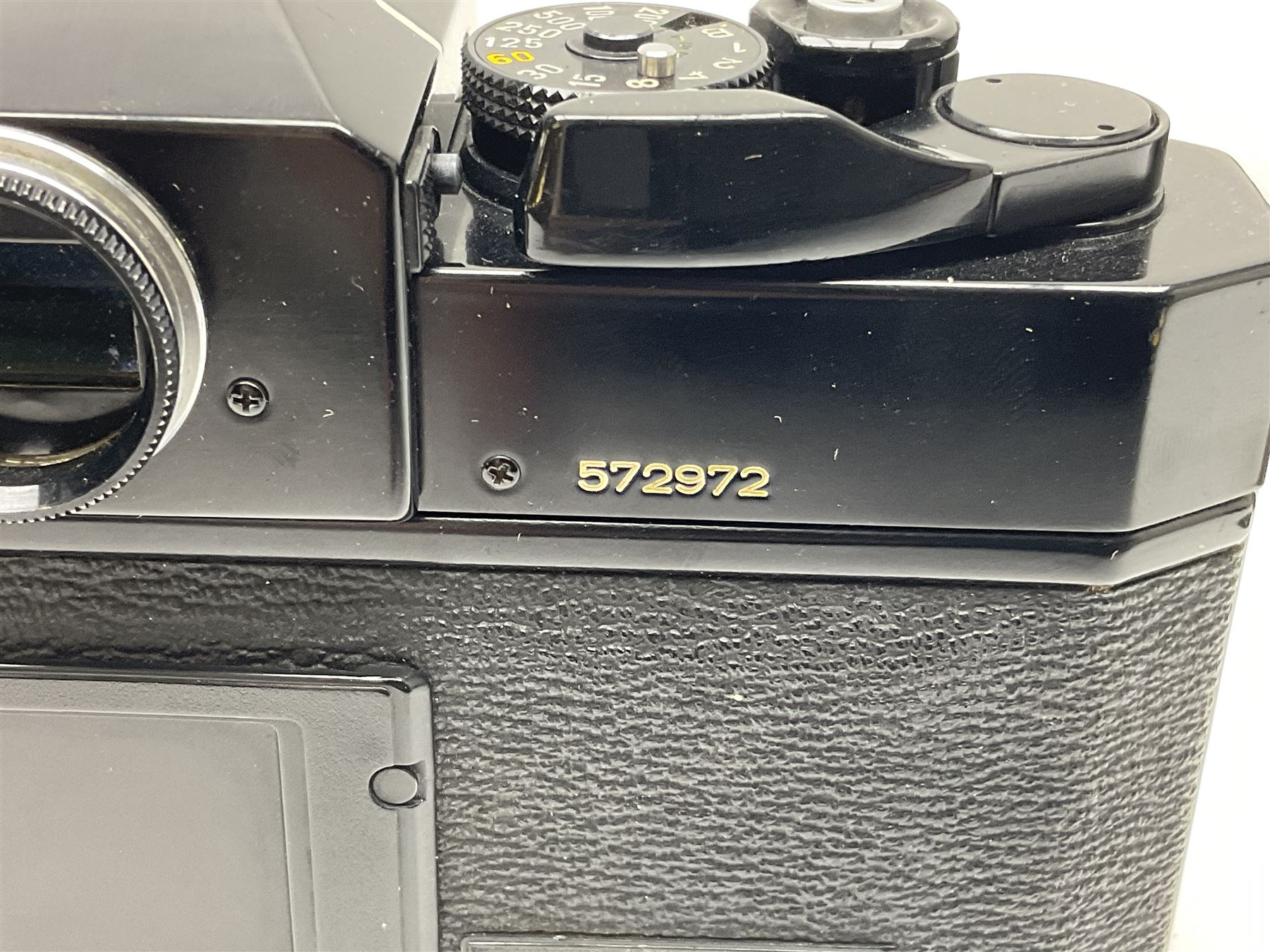 Canon F1n camera body, serial no. 572972, with 'Canon FD 50mm 1:1.4' lens, serial no. 246665, with leather case 