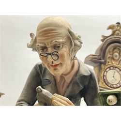 Two Capodimonte figures, comprising The Watchmaker by Curiase and Tramp Seated on a Bench, created by D.Bonalberti, tallest example H24cm