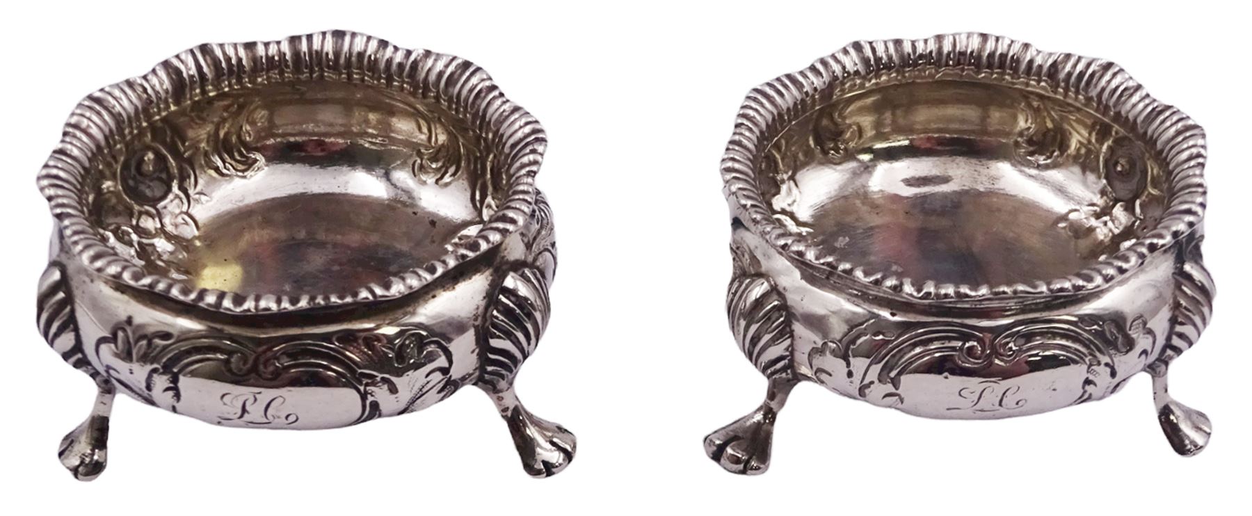 Pair of Victorian silver open salts, each of cauldron form with gadrooned rims and embossed flower heads to body, upon three paw feet, hallmarked Charles Stuart Harris, London 1892, approximate weight 3.05 ozt (95 grams)