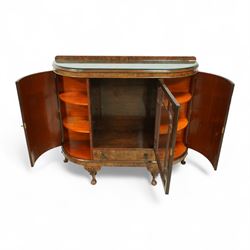 Early 20th century burr walnut display side cabinet, the glass inset top over a central glazed door with geometric astragal glazing, flanked by curved cupboards, shaped apron fitted with drawer, on cabriole legs with shell carved knees and pad feet