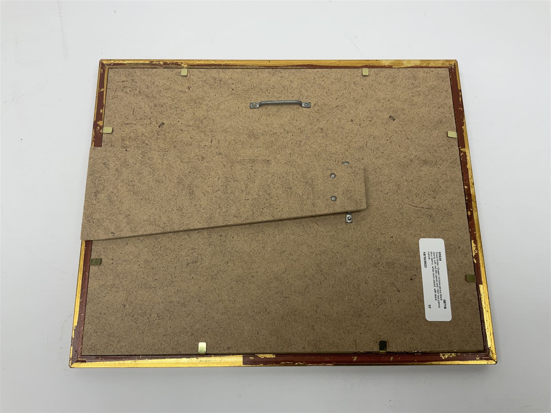 Great Britain Queen Victoria penny black stamp with red MX cancel and 1841 two pence blue stamp, white lines added, with black cancel, housed in a framed display